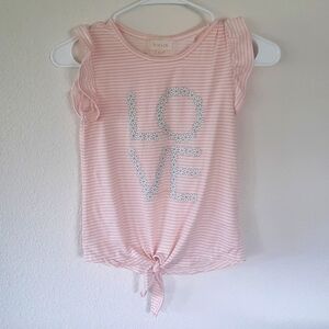 Between girl's shirt size 7